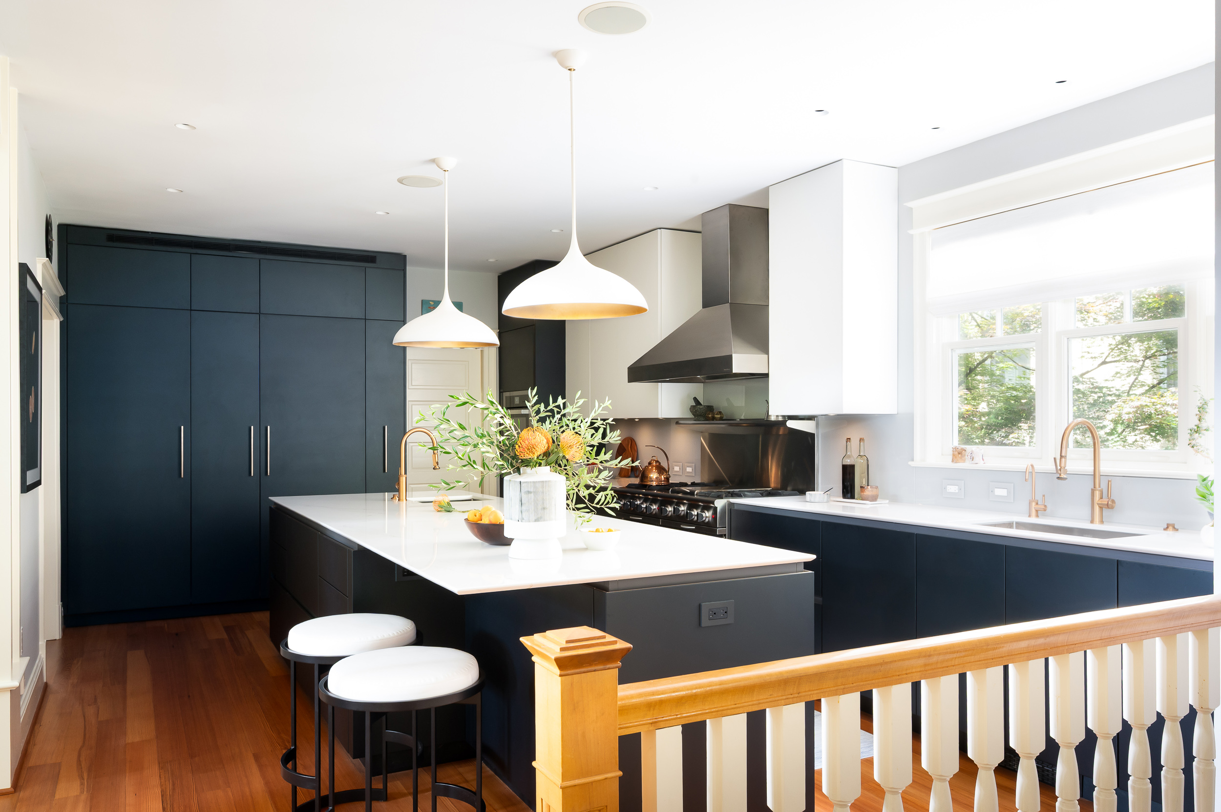 Wide view of modern kitchen and island