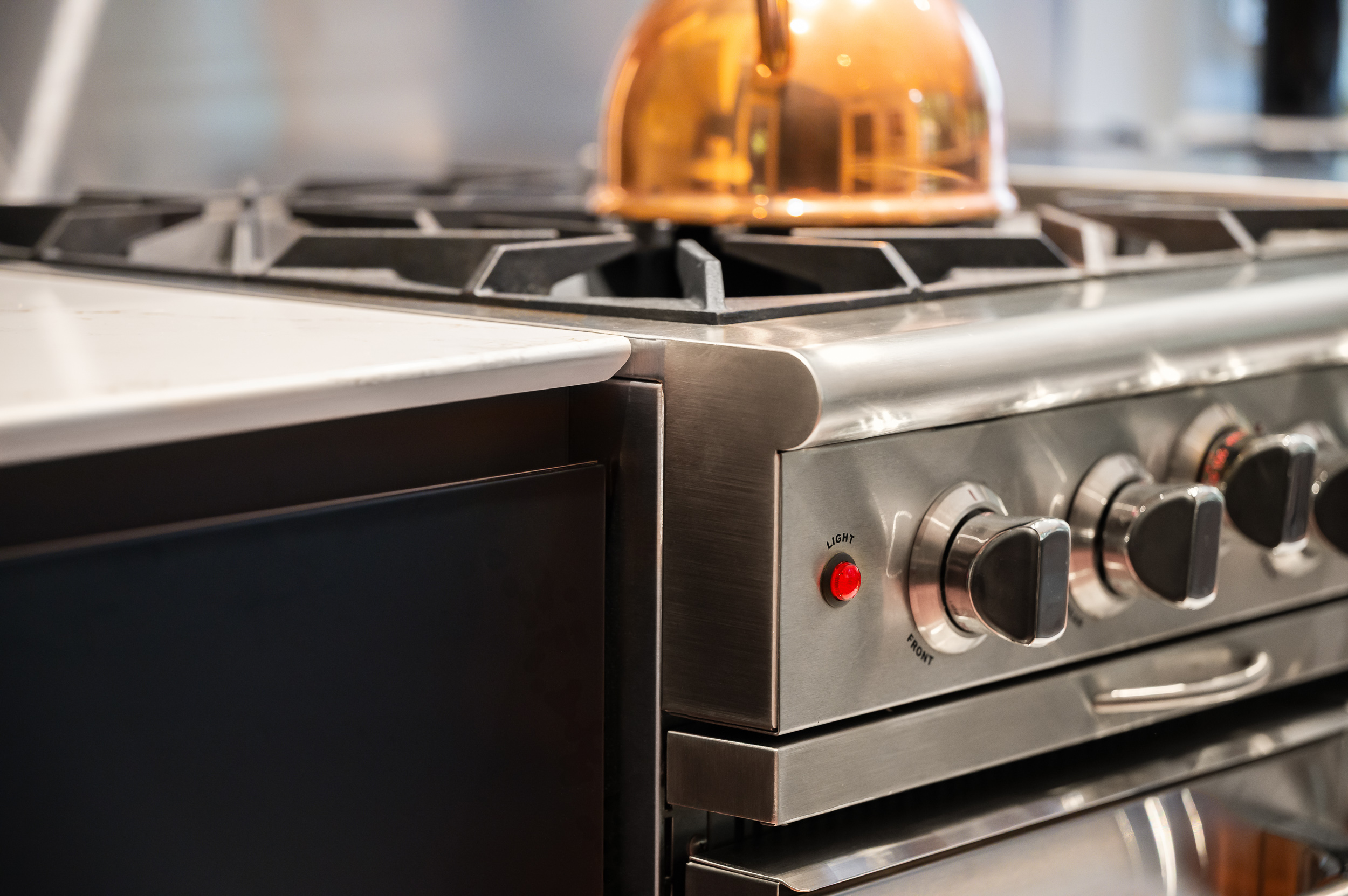 Range and cooking area in modern kitchen